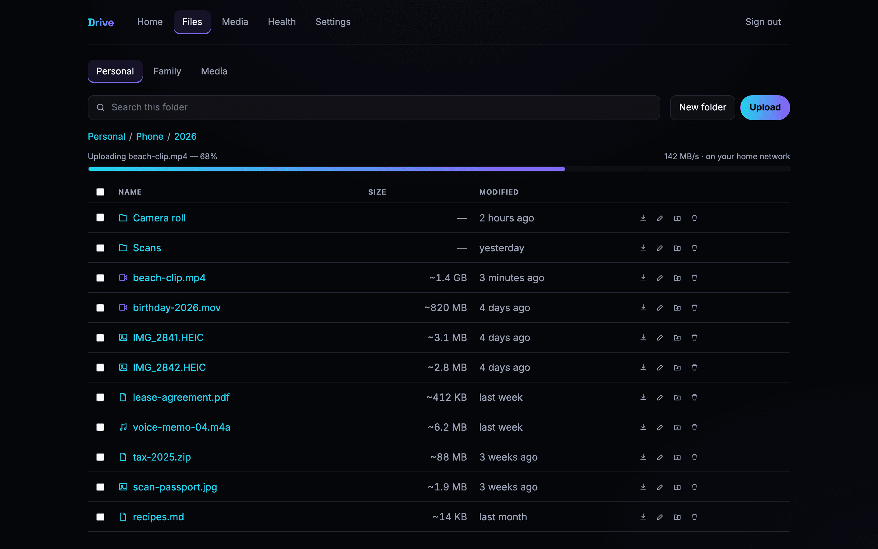 Drive web app file browser with a sortable table, breadcrumbs and an upload in progress